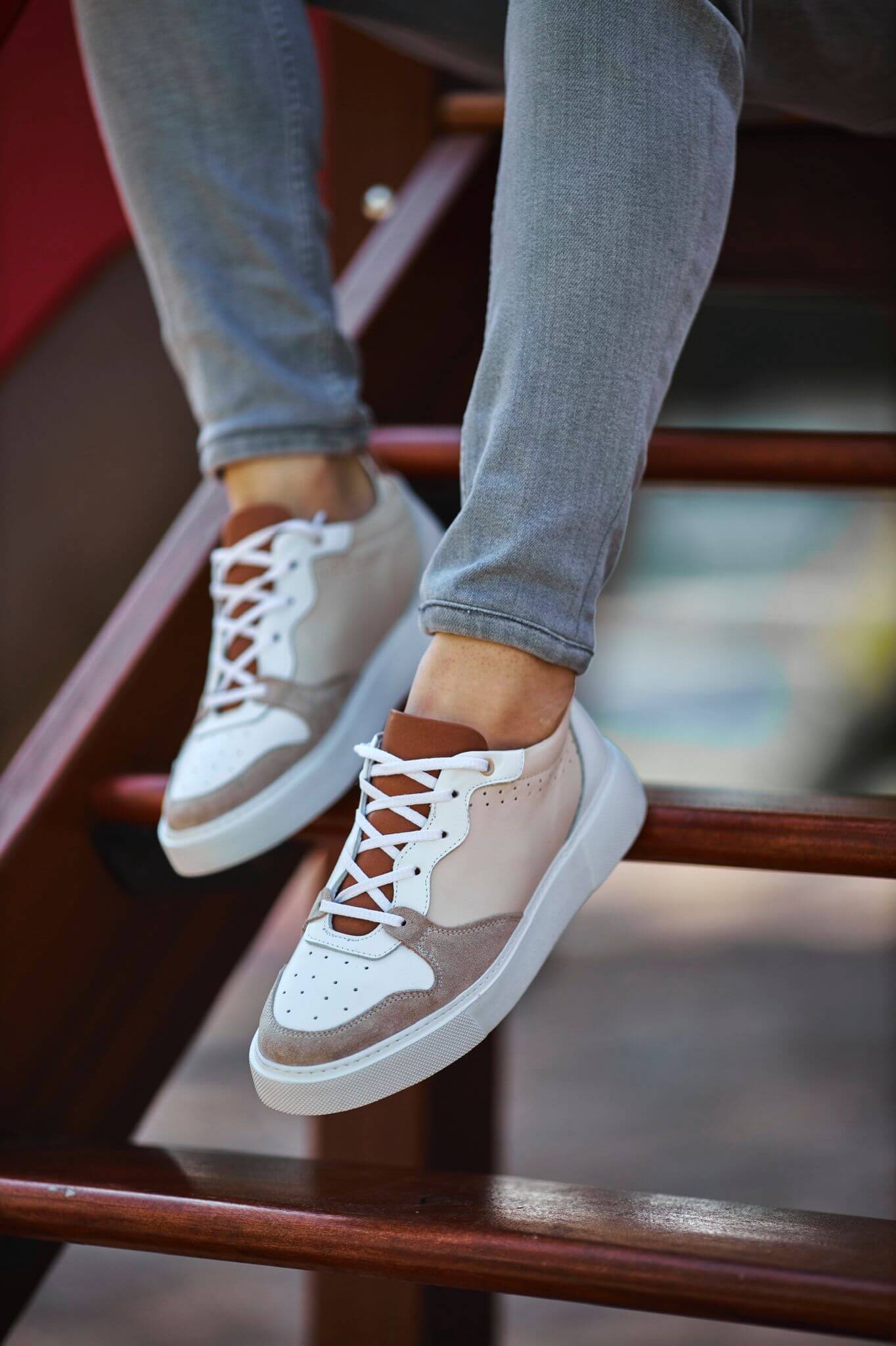 A Beige Lace Up Sneaker on display.