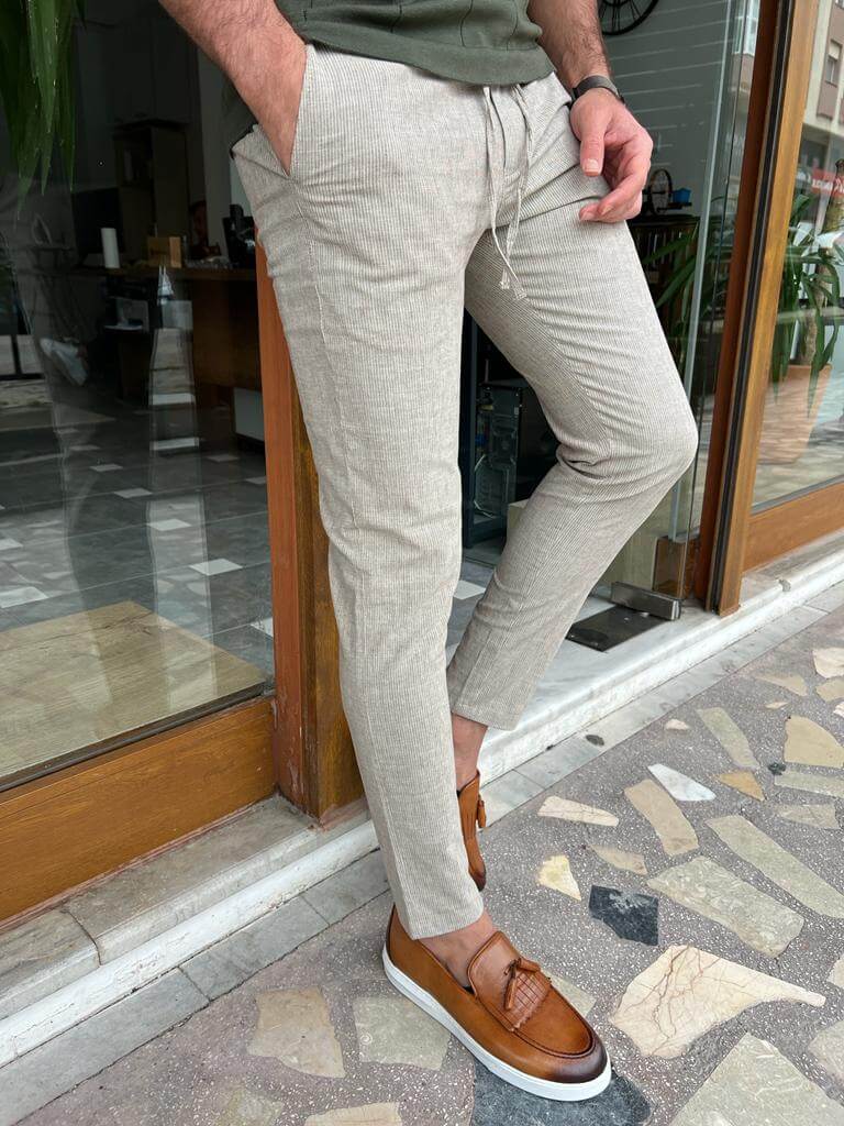  Beige linen trousers suitable for both casual and formal occasions."