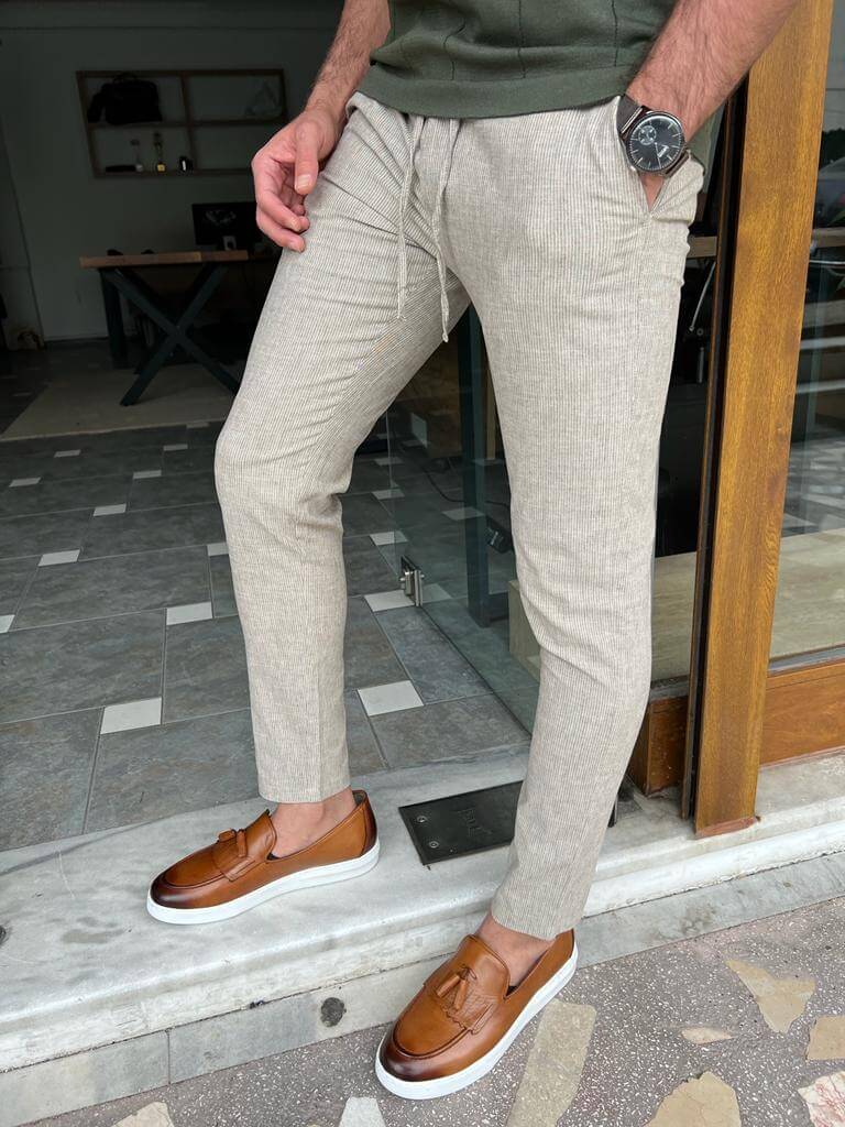  Beige linen trousers suitable for both casual and formal occasions."