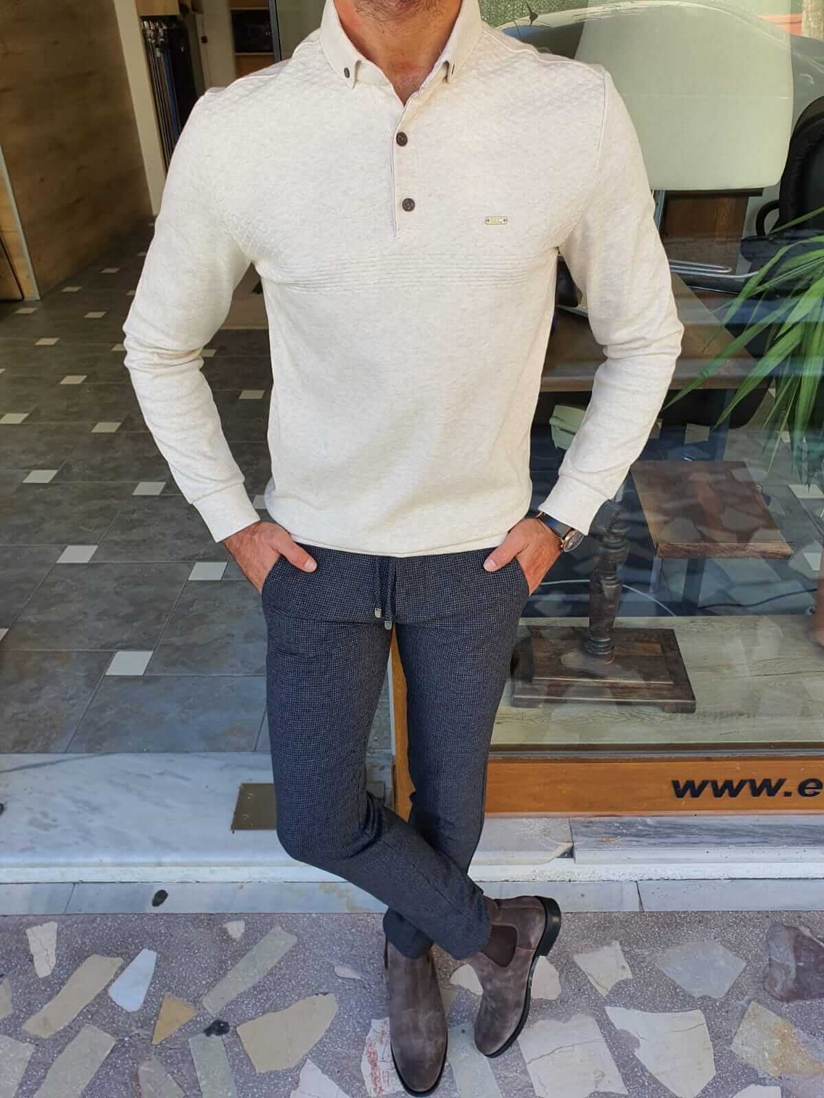 A beige longsleeve combed knitwear garment with a soft, textured surface.