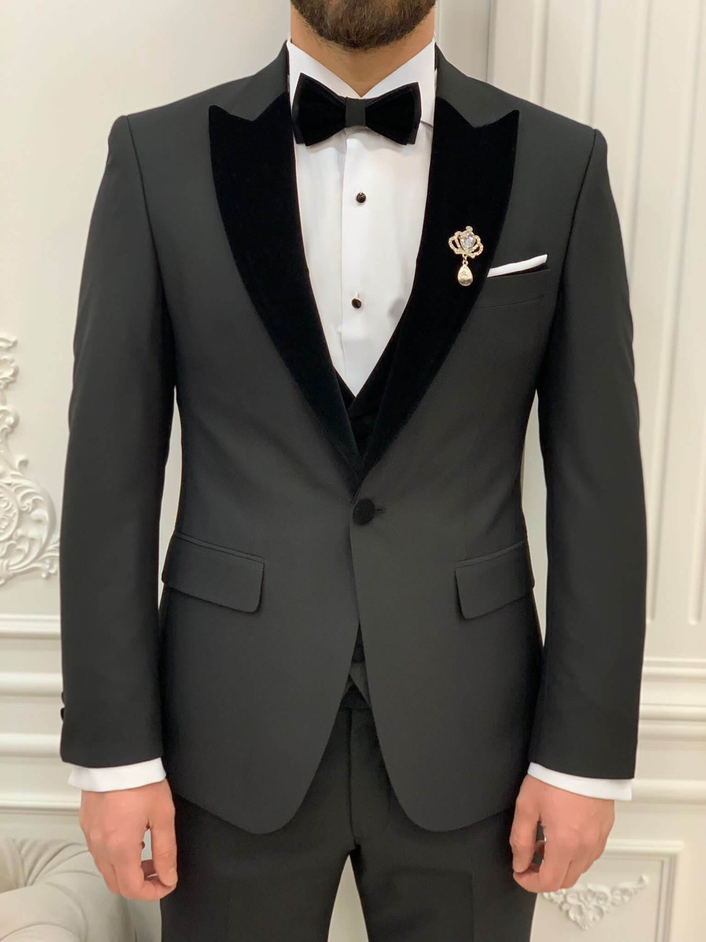 Model Wearing Black Tuxedo with Peak Lapel, Single Button, Slim-Fit Italian Cut at Formal Event