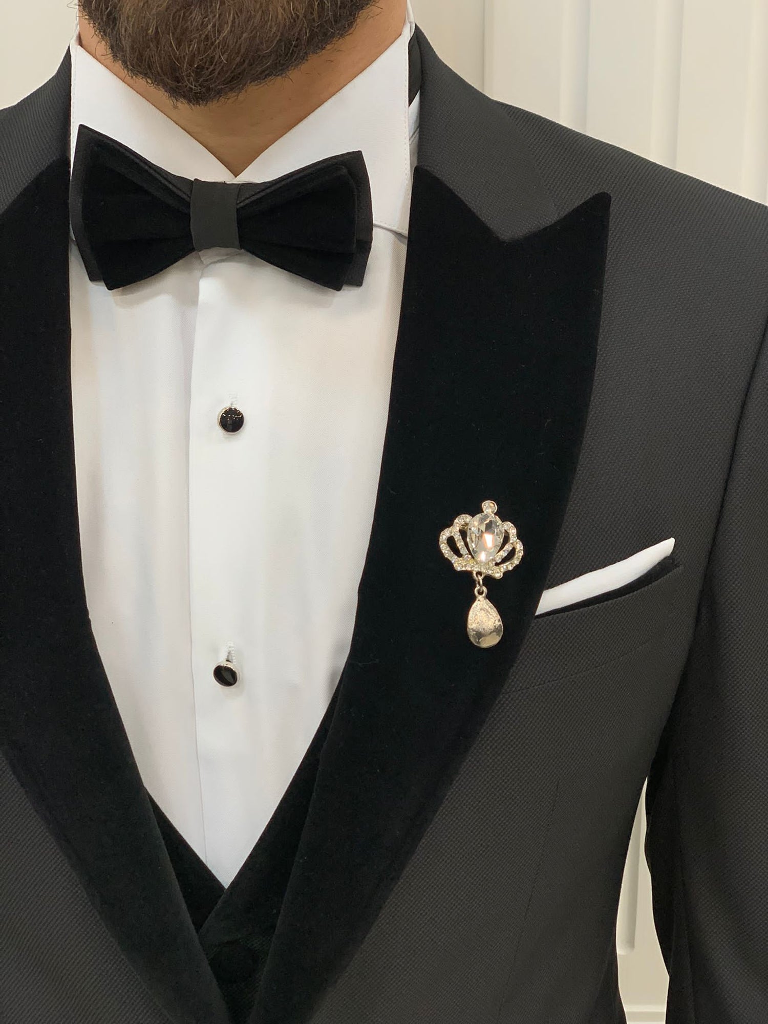 Model Wearing Black Tuxedo with Peak Lapel, Single Button, Slim-Fit Italian Cut at Formal Event