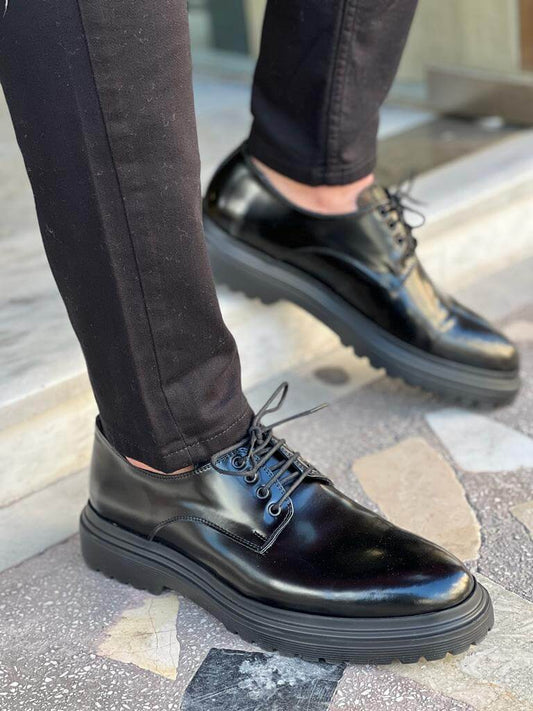 Black leather Derby shoes featuring a classic lace-up design and EVA sole, ideal for formal and smart casual occasions.