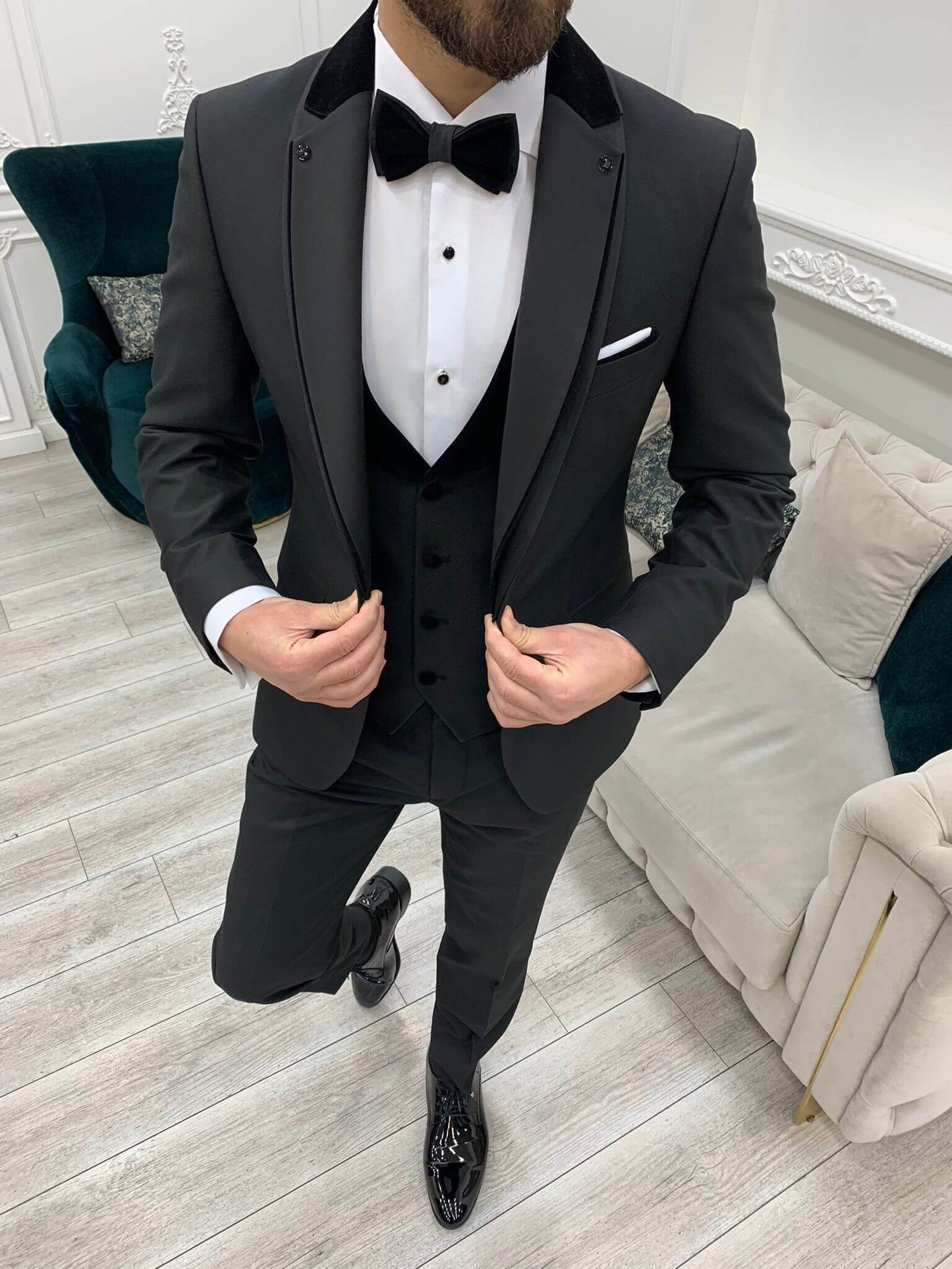 Model Wearing Black Tuxedo with Unique Shawl Lapel, Single Button, Double Slit, Slim-Fit Italian Cut at Formal Event