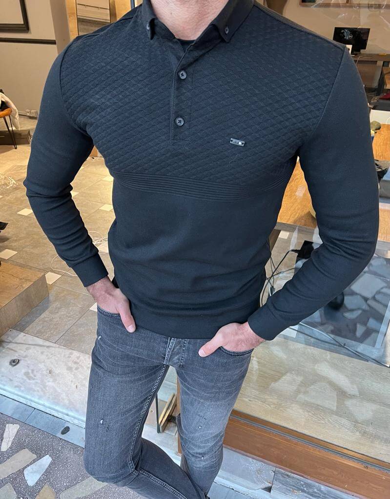 A black polo collar knitwear with a textured pattern, perfect for a sophisticated and casual look."