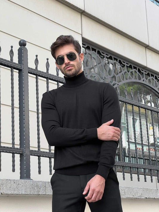 A black turtleneck sweater with a ribbed texture, worn by a  model