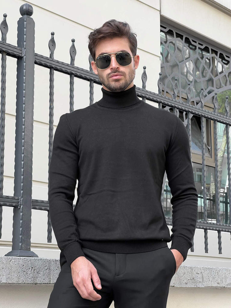 A black turtleneck sweater with a ribbed texture, worn by a model