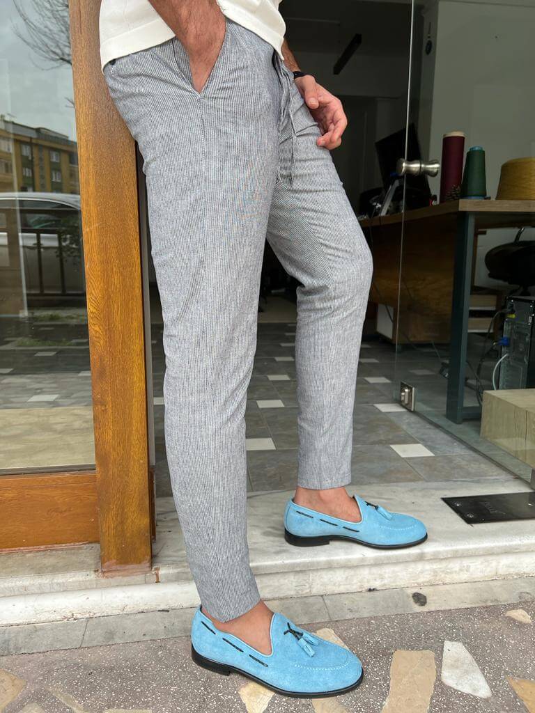 Blue linen trousers with a relaxed fit and a comfortable feel
