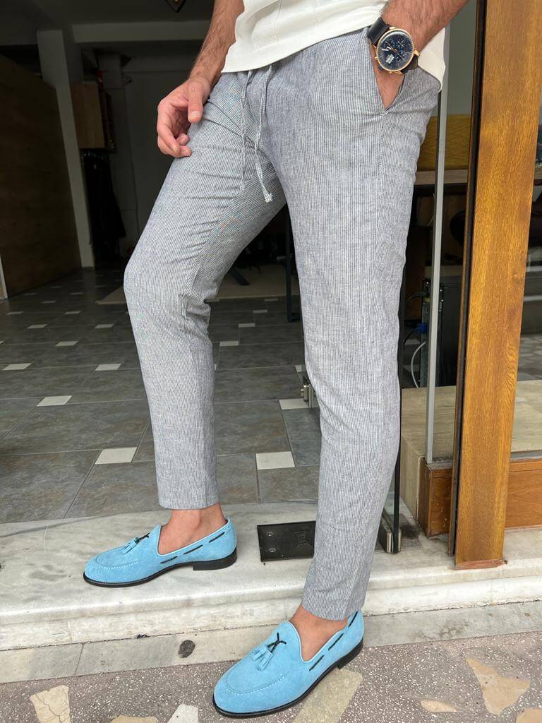 Blue linen trousers with a relaxed fit and a comfortable feel