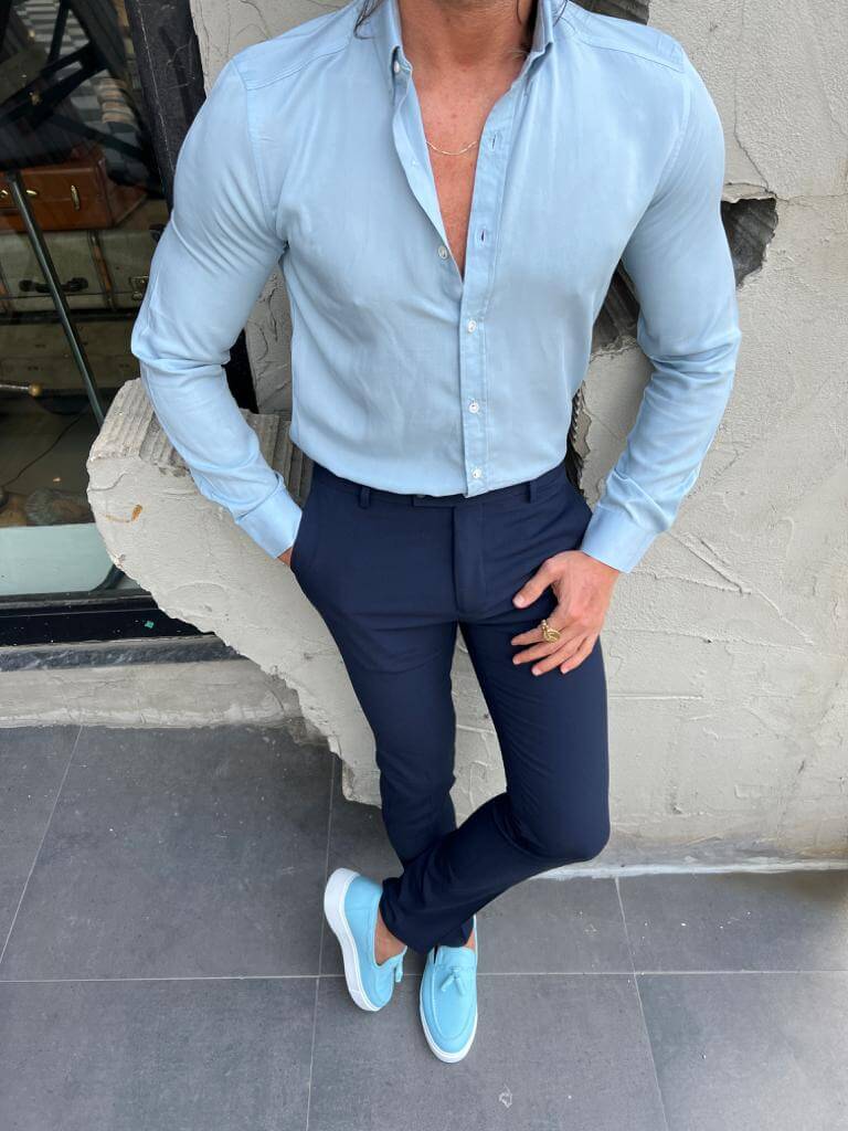 A stylish blue long sleeve shirt featuring a modern and slim fit design