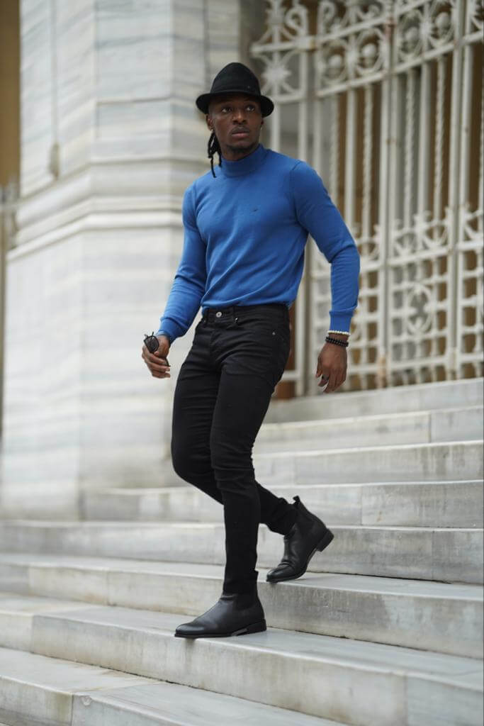 A vibrant blue mock turtleneck shirt with long sleeves.