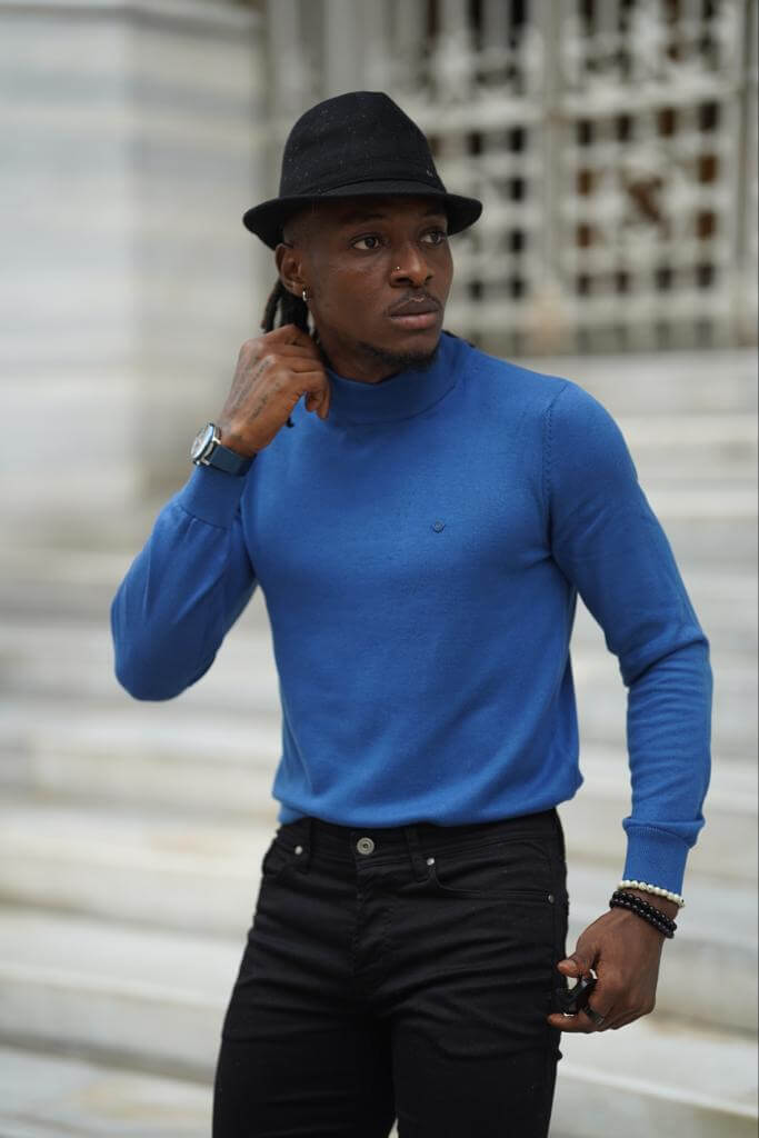 A vibrant blue mock turtleneck shirt with long sleeves.