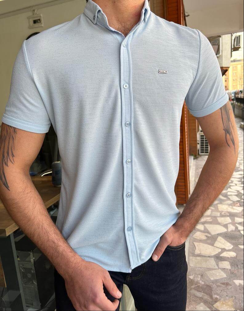 A blue button-down shirt with short sleeves.