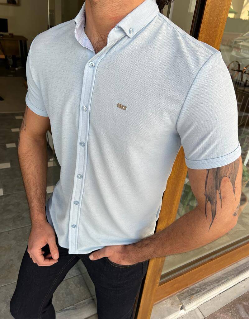 A blue button-down shirt with short sleeves.