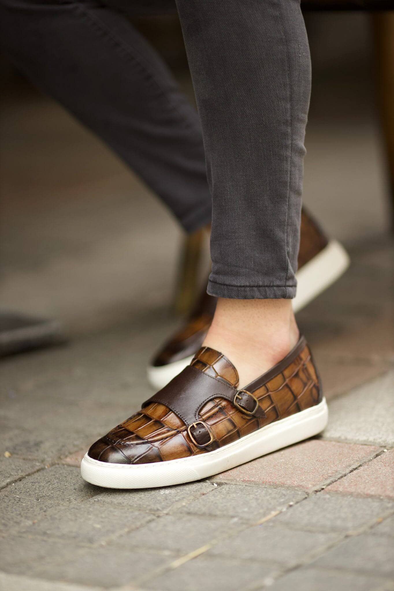 A Brown Buckled Detailed Loafer on display.