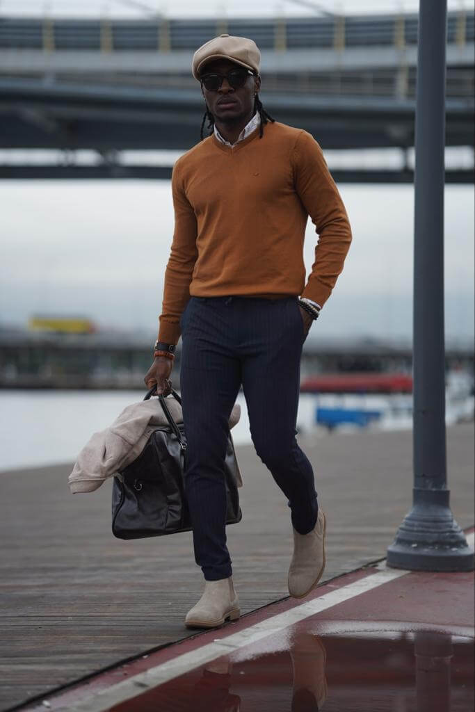  A camel-colored V-neck sweater with a soft and cozy texture, perfect for chilly days
