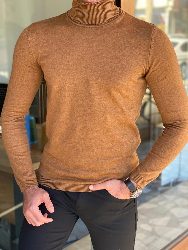 A stylish camel-colored turtleneck sweater, perfect for chilly weather in Cardiff. The sweater features a high neck and a cozy, knitted texture."