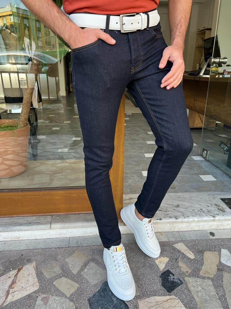 Slim-fit dark blue jeans, perfect for a casual yet polished outfit