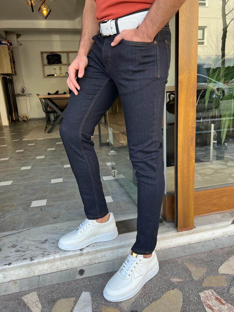 Slim-fit dark blue jeans, perfect for a casual yet polished outfit