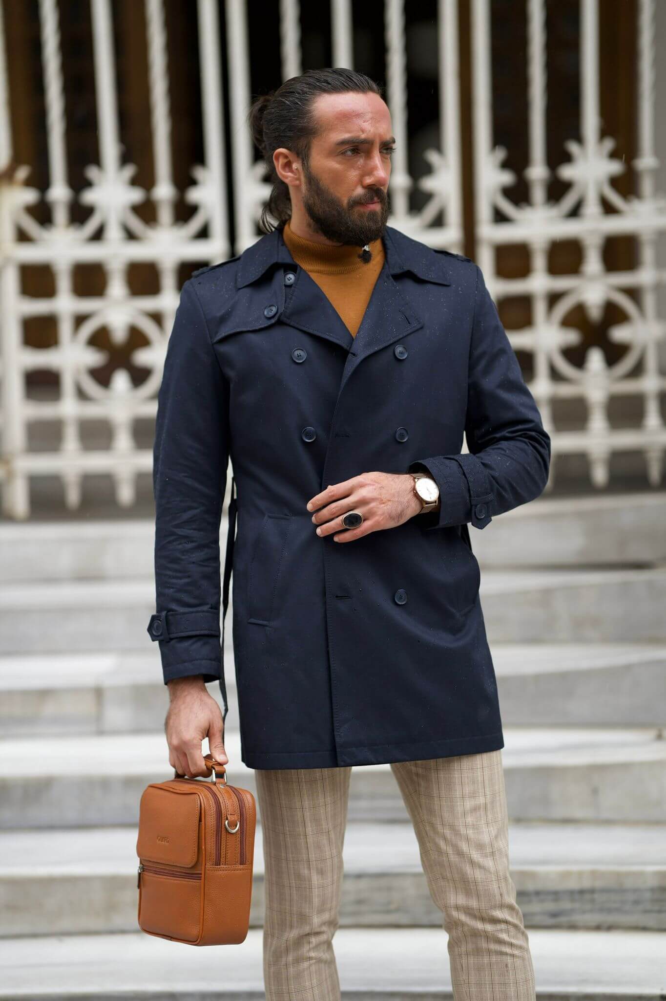 Dark blue trench coat with a belted waist for a flattering fit