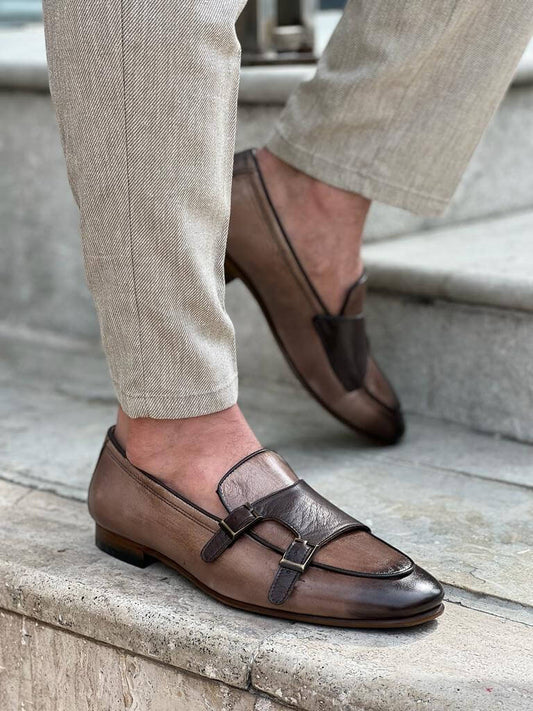Beige leather monk strap shoes featuring a sleek double buckle design and neolite sole, offering a versatile and refined finish for spring and summer looks.