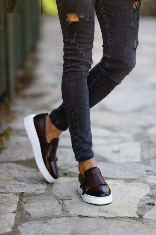 A pair of Santiago brown double-buckle monk strap loafers crafted from genuine leather, featuring a sleek silhouette with a modern white EVA sole.