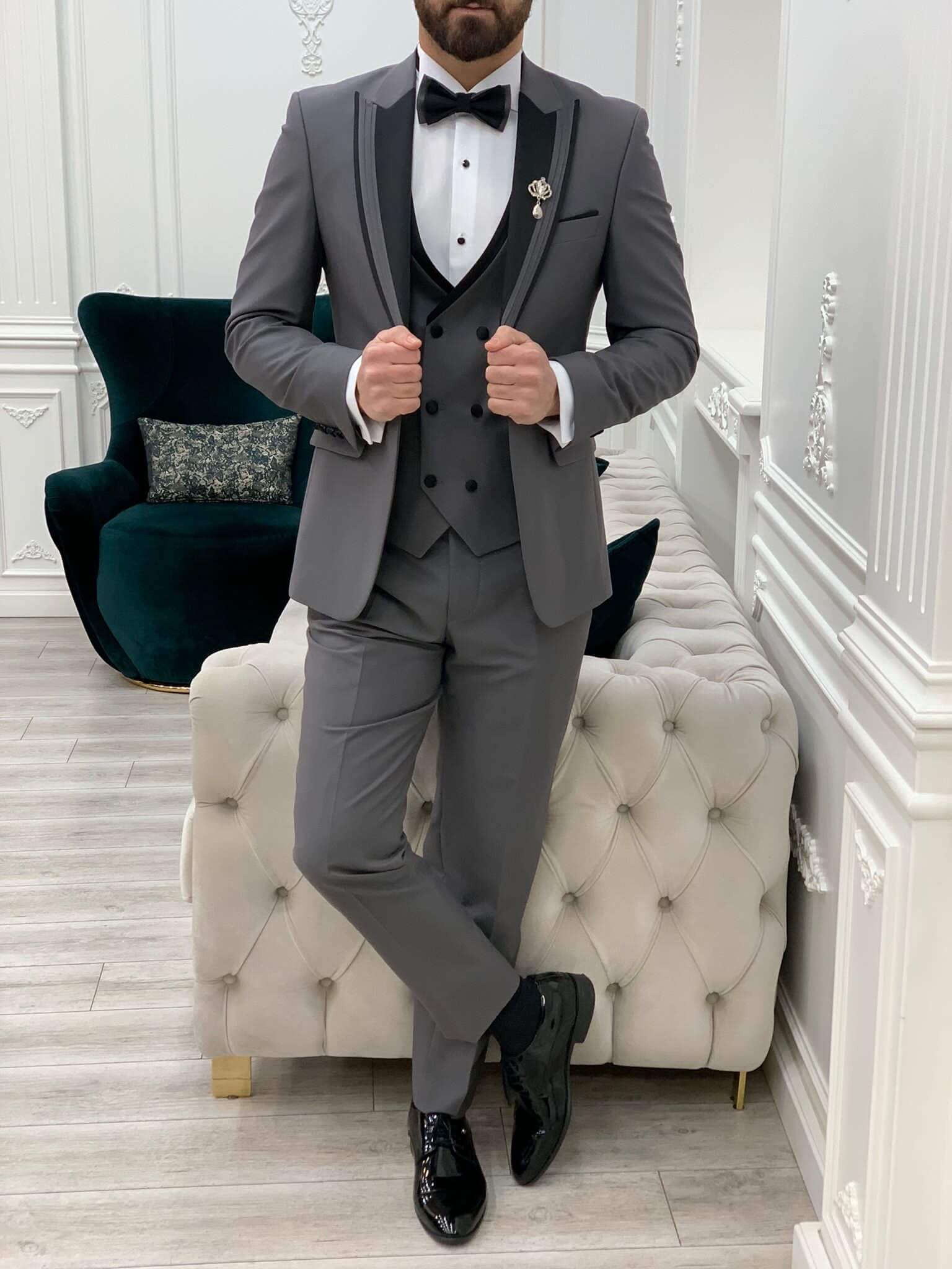 Model Wearing Gray Tuxedo with Black and Gray Patterned Peak Lapel, Single Button, Double Slit, Slim-Fit Italian Cut at a showroom