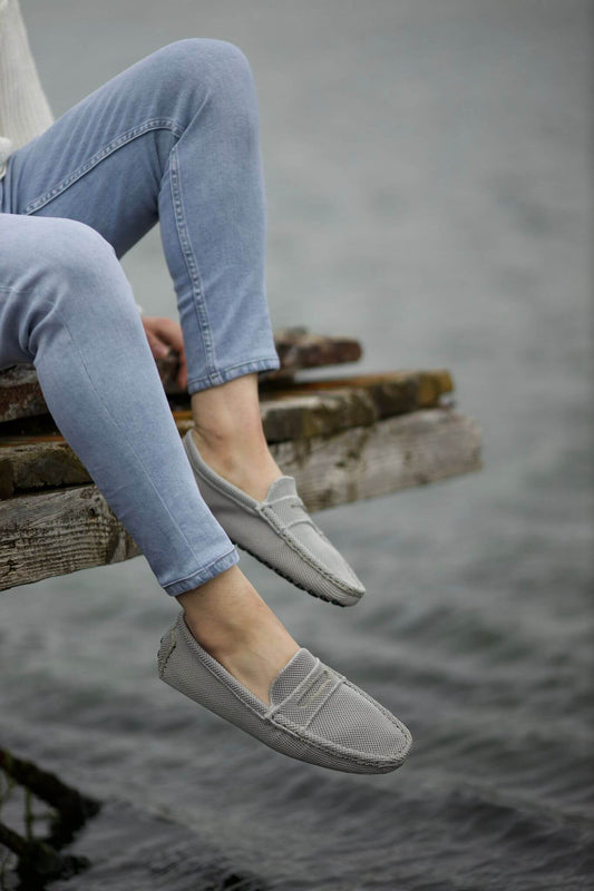 A Gray Driving Loafer on display. 