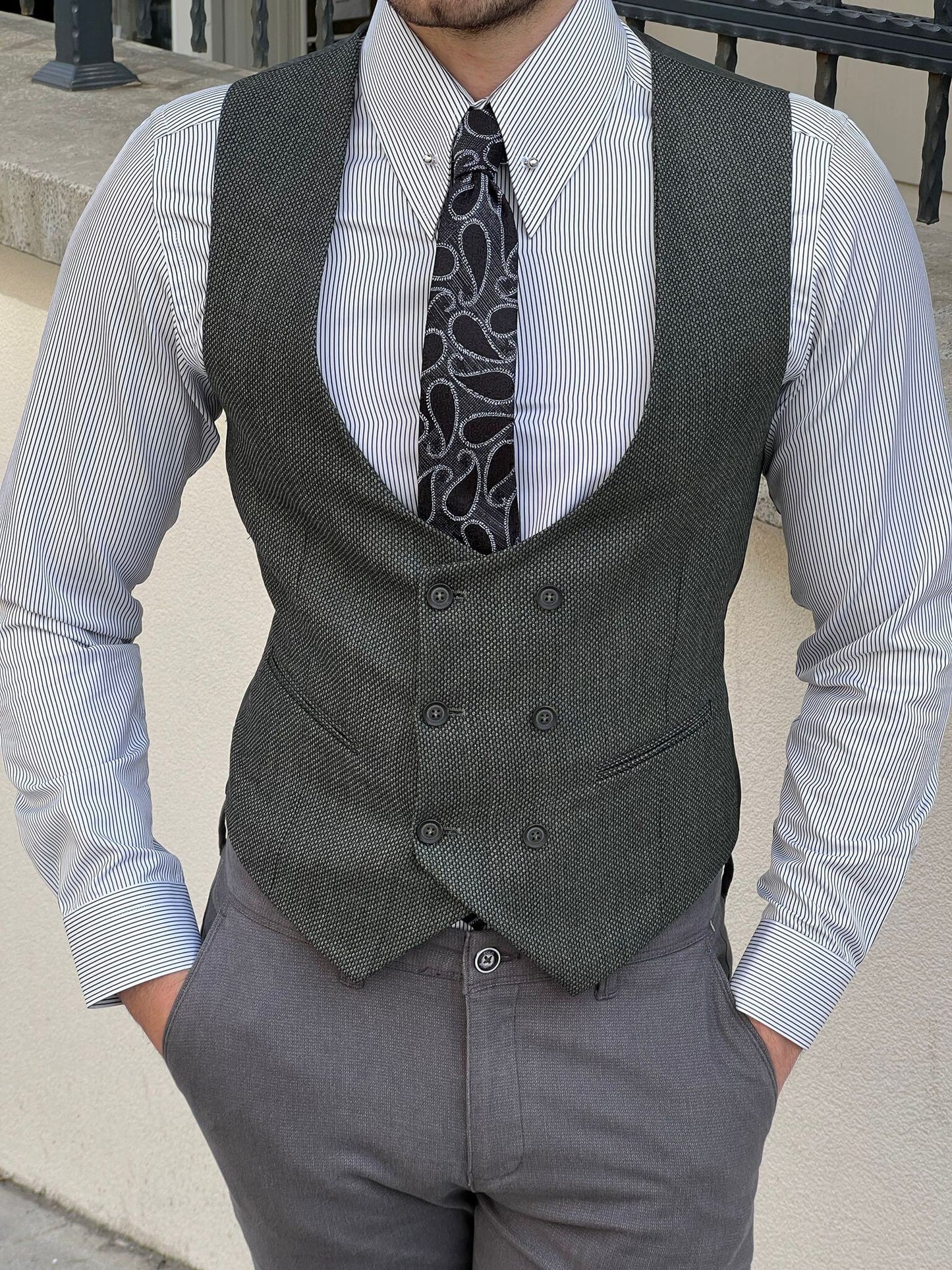 A vibrant green double-breasted vest with a sleek, tailored fi