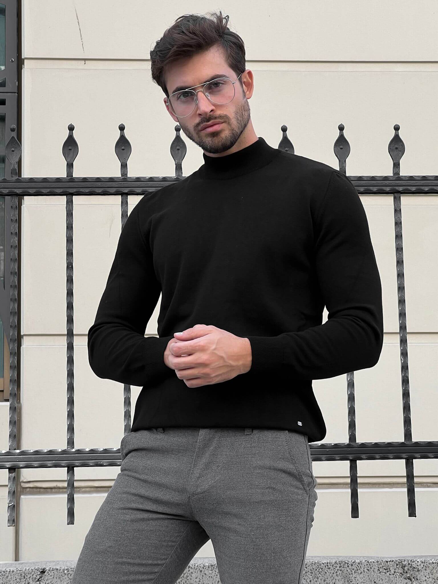 Hart Black Mock Turtleneck": A close-up view of a stylish black mock turtleneck sweater with a comfortable fit and sleek design.