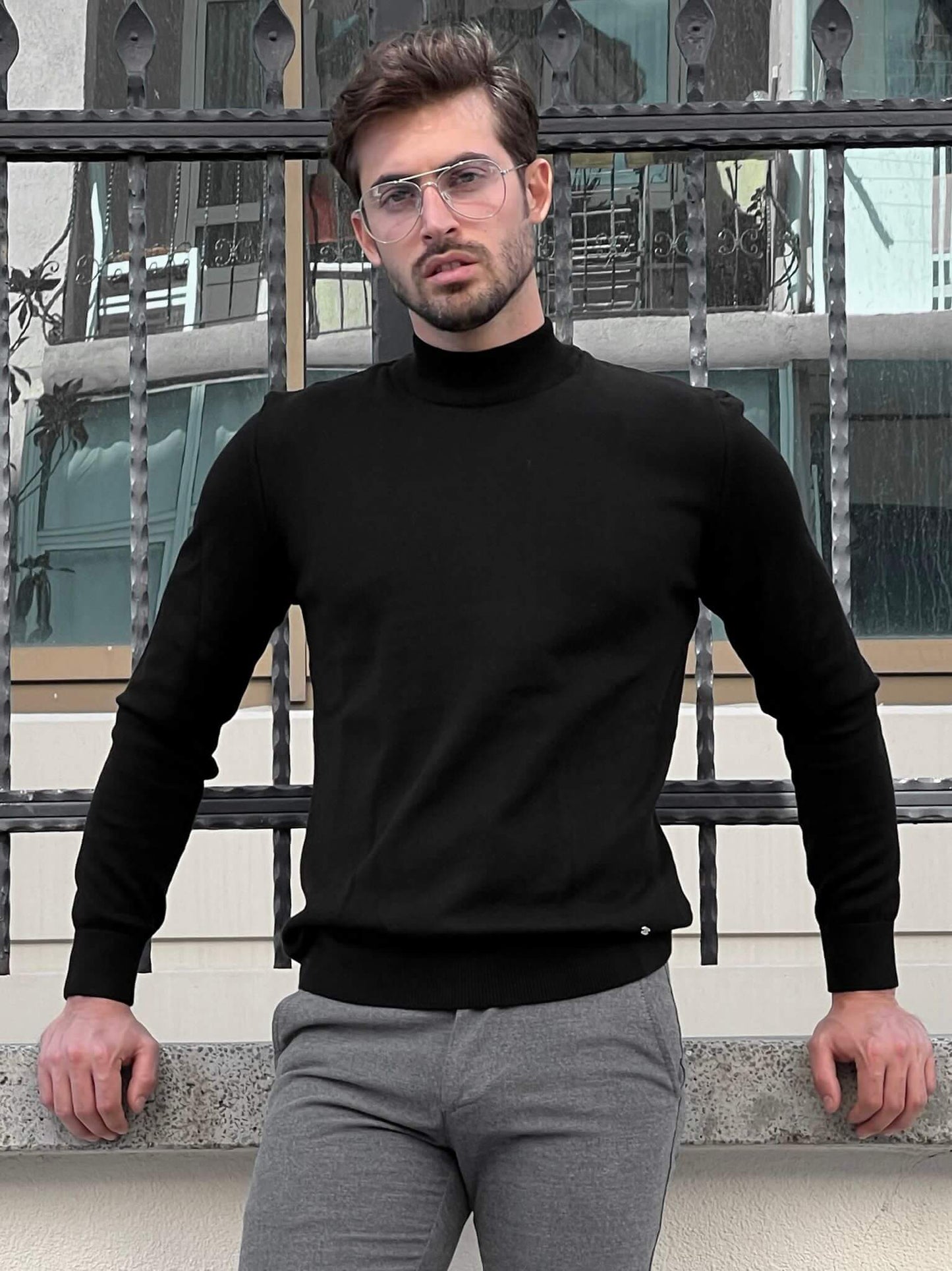 Hart Black Mock Turtleneck": A close-up view of a stylish black mock turtleneck sweater with a comfortable fit and sleek design.