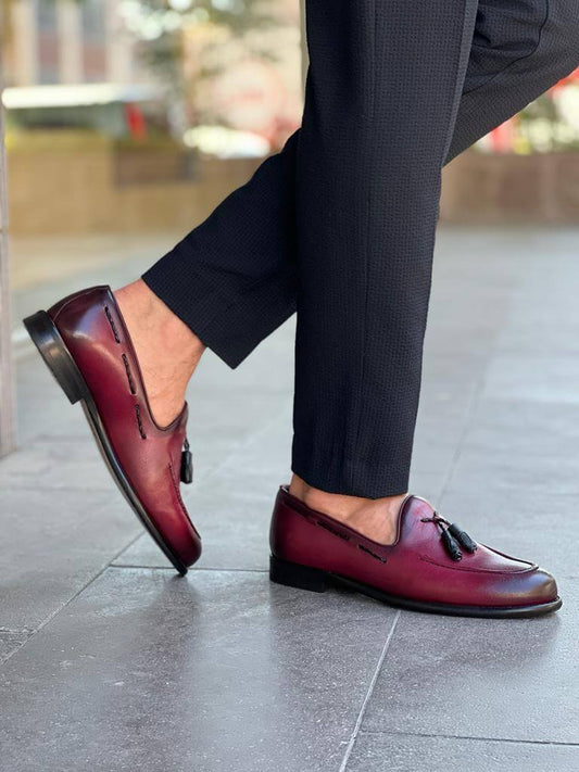 Elegant burgundy leather loafers with tassel detailing and neo-lite soles, designed for stylish spring and summer wear.
