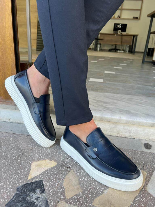 Elegant navy blue penny loafers made from genuine leather, displayed with a minimalist design and EVA sole, suitable for casual and smart-casual occasions.