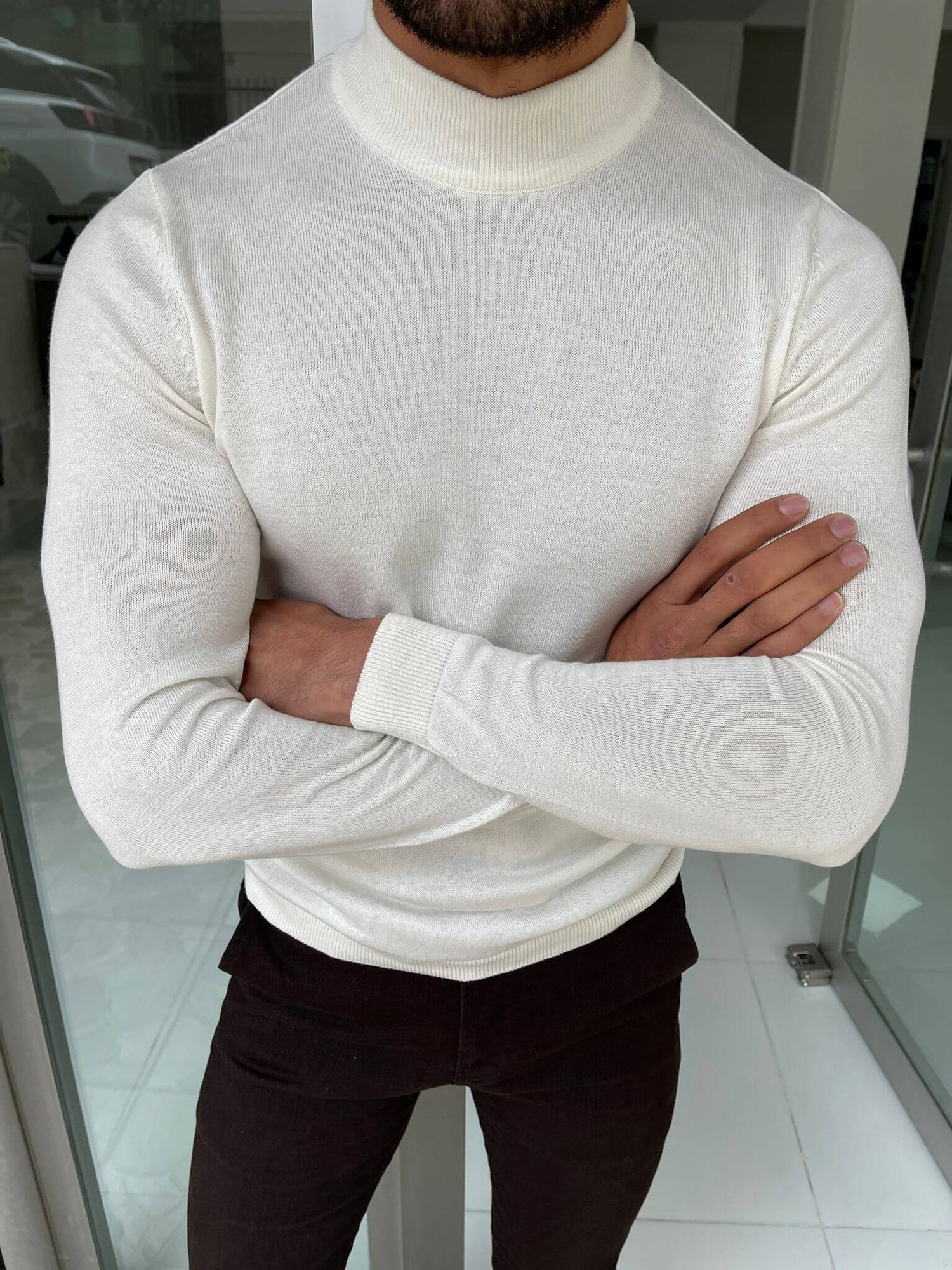 "An elegant Hollo Ecru Turtleneck, a soft and cozy turtleneck sweater in a neutral ecru color, perfect for cool weather and versatile for any occasion