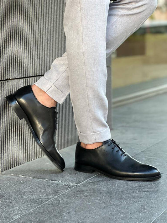 Sleek black leather Oxford shoes with a classic lace-up design and neo-lite sole, crafted for elegant formal and office wear.