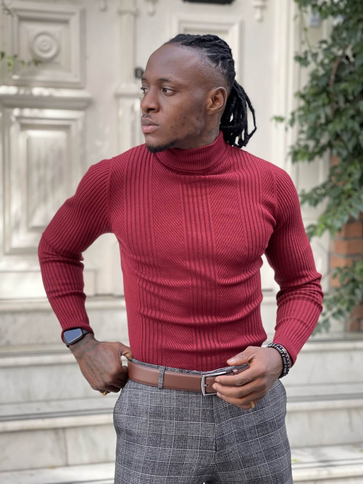 A red turtleneck sweater for men, featuring a comfortable and stylish design with a high neckline and long sleeves
