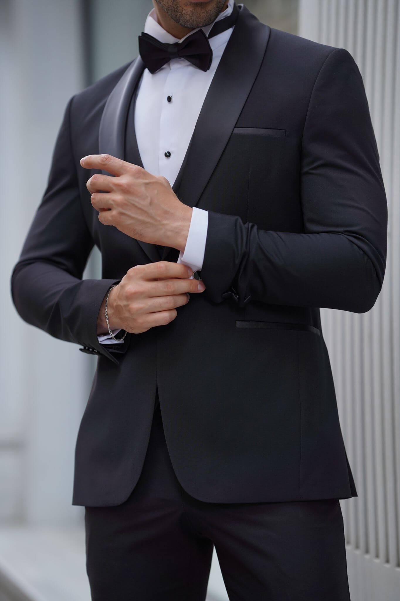 A Slim-Fit Shawl Collar Black Tuxedo Suit on display. 