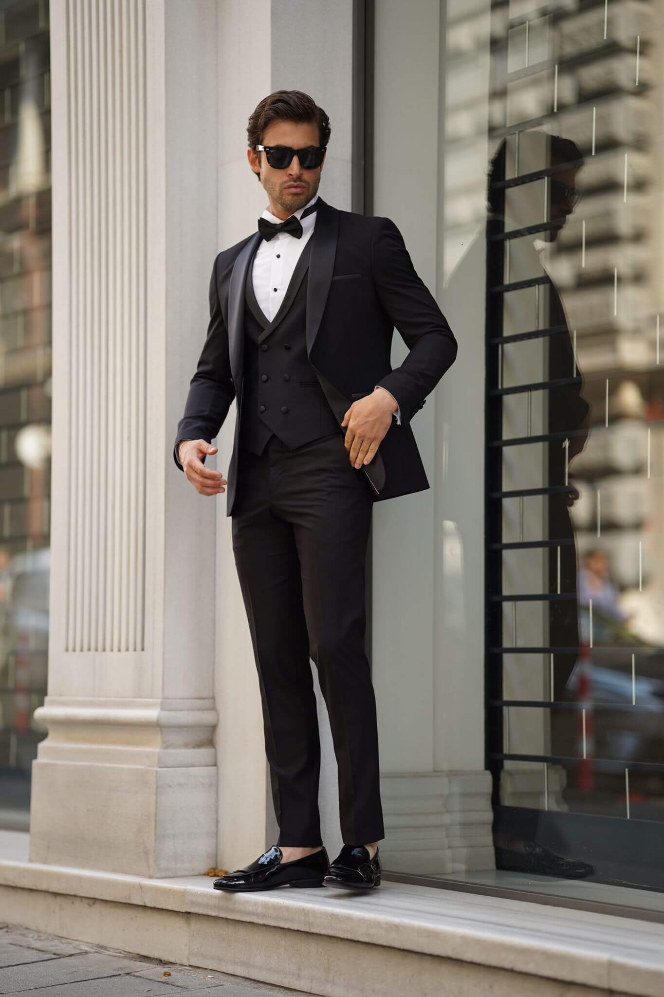 A Slim-Fit Shawl Collar Black Tuxedo Suit on display.