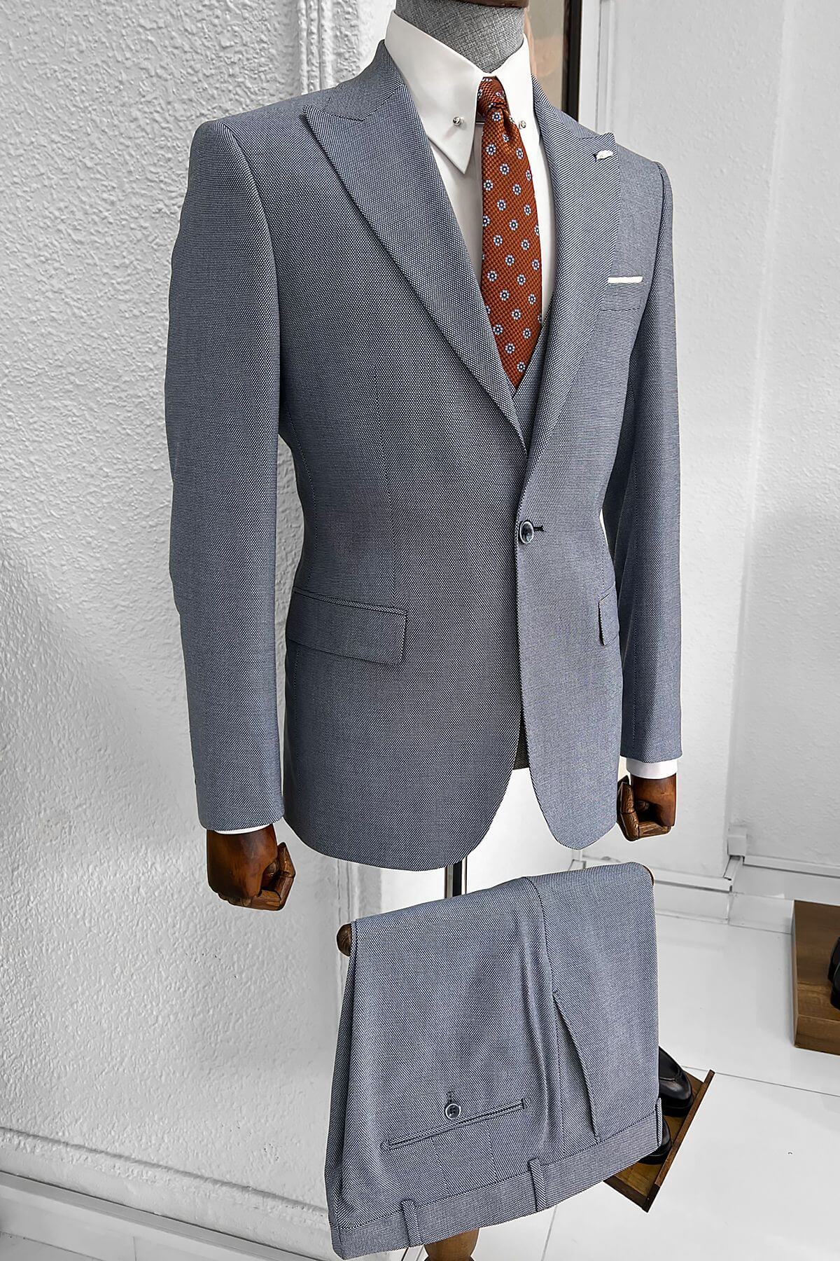 A Patterned Slim-fit Light Blue Wool Suit on display