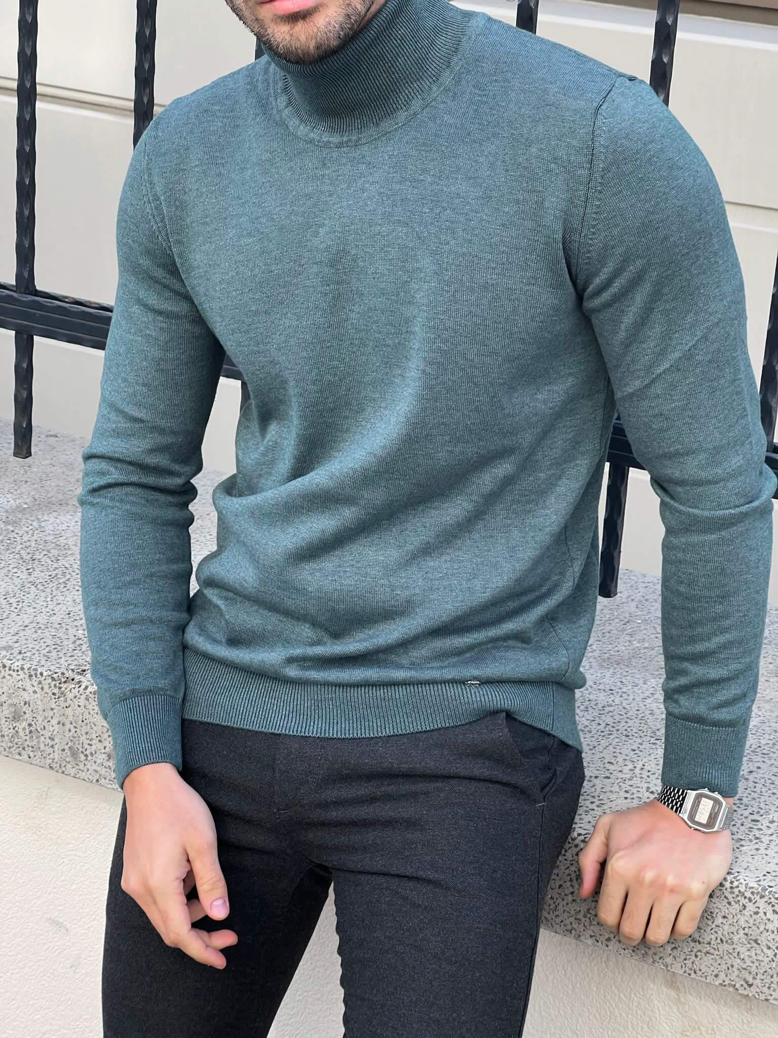 "Close-up of a mint green turtleneck sweater  with long sleeves and a fitted silhouette, creating a stylish and cozy look.