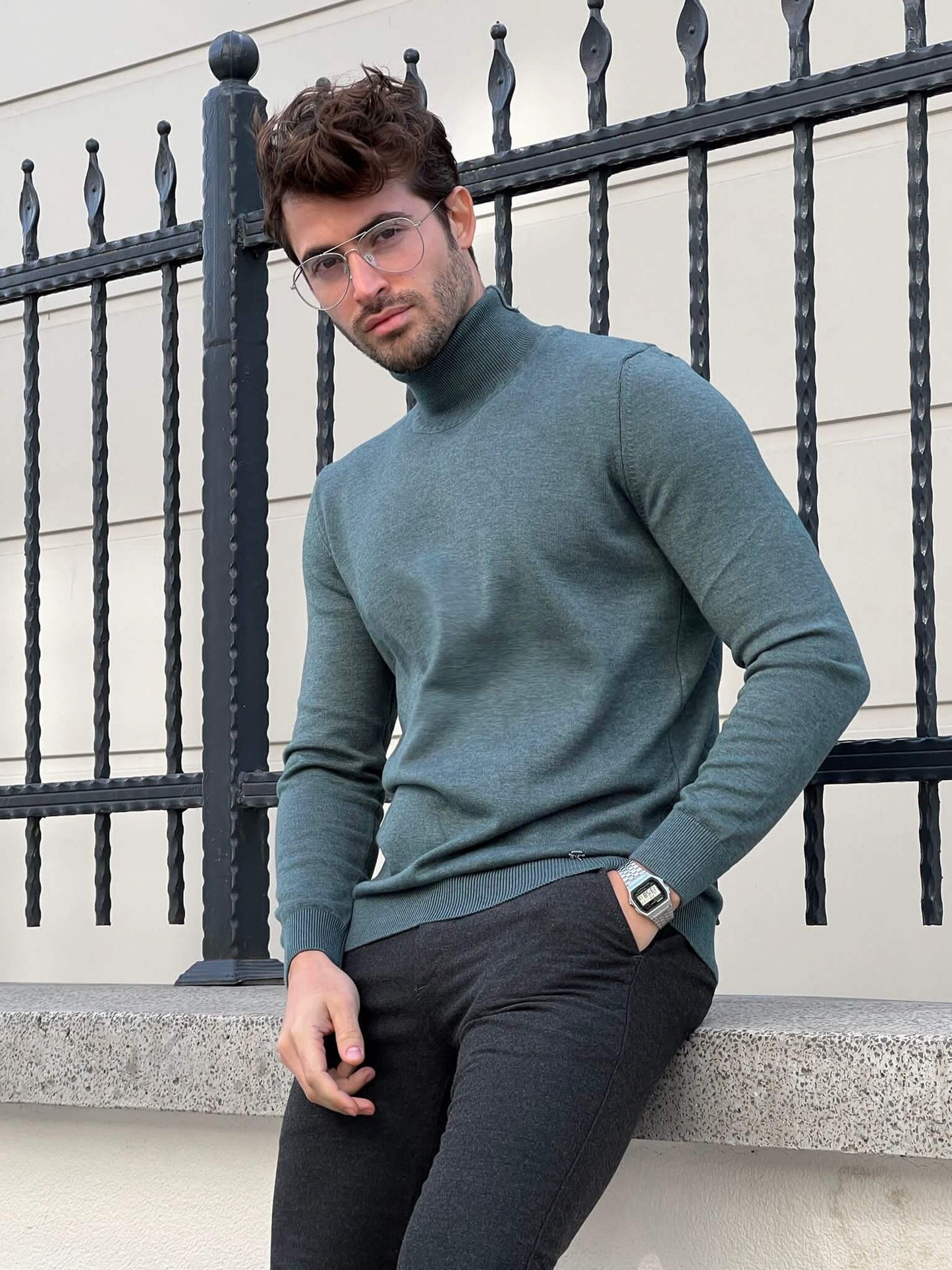 "Close-up of a mint green turtleneck sweater  with long sleeves and a fitted silhouette, creating a stylish and cozy look.