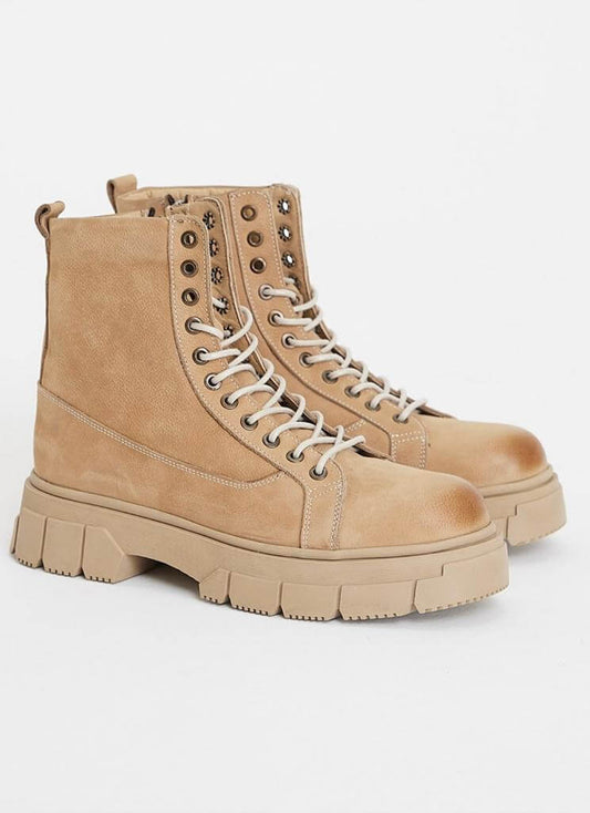 Monteverde Beige Lace Up Boots shown side-by-side against a plain white background, highlighting the structured design, eyelets, and contrast stitching.