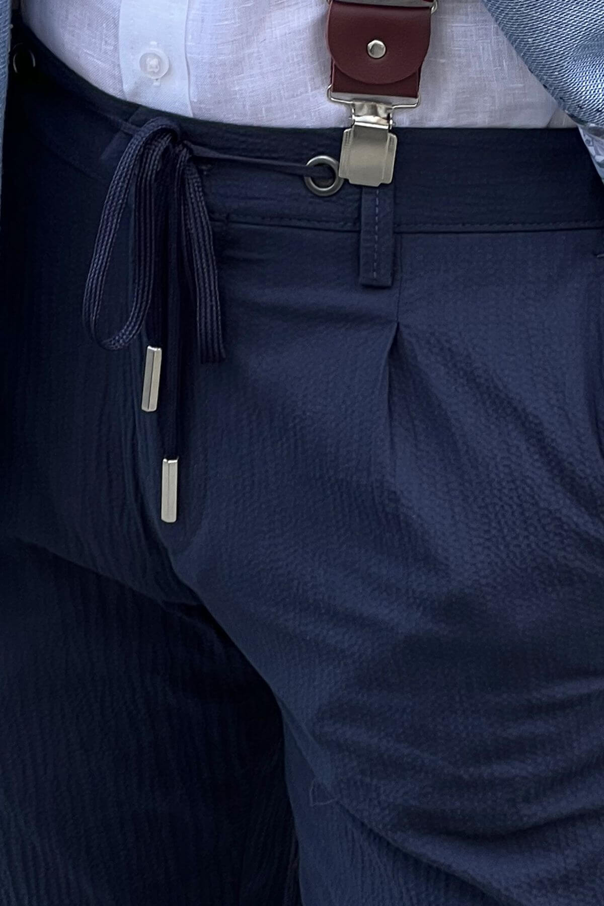 A Slim Fit Navy Blue Trouser on display