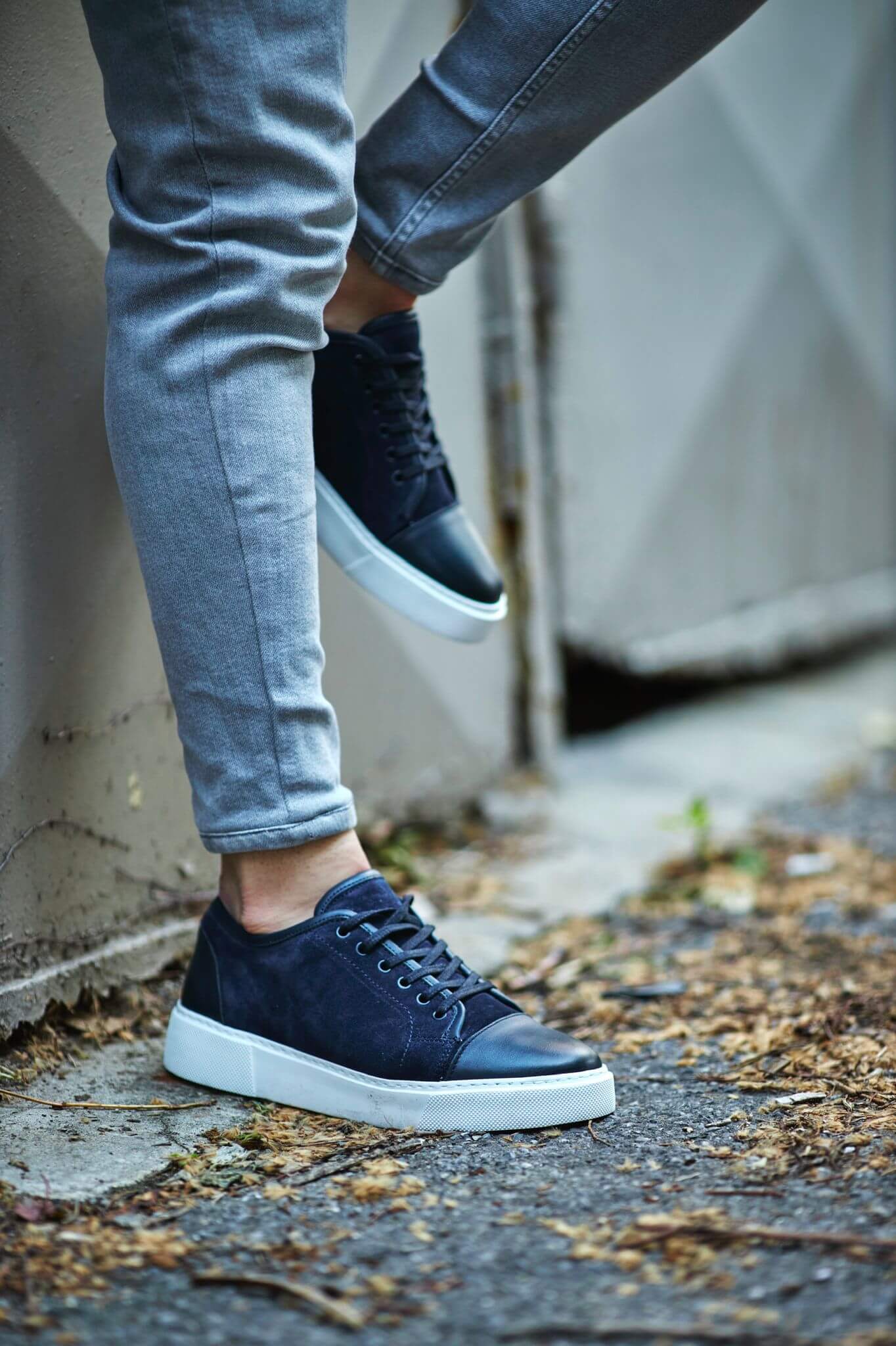 A Navy Blue Lace up Sneaker on display.