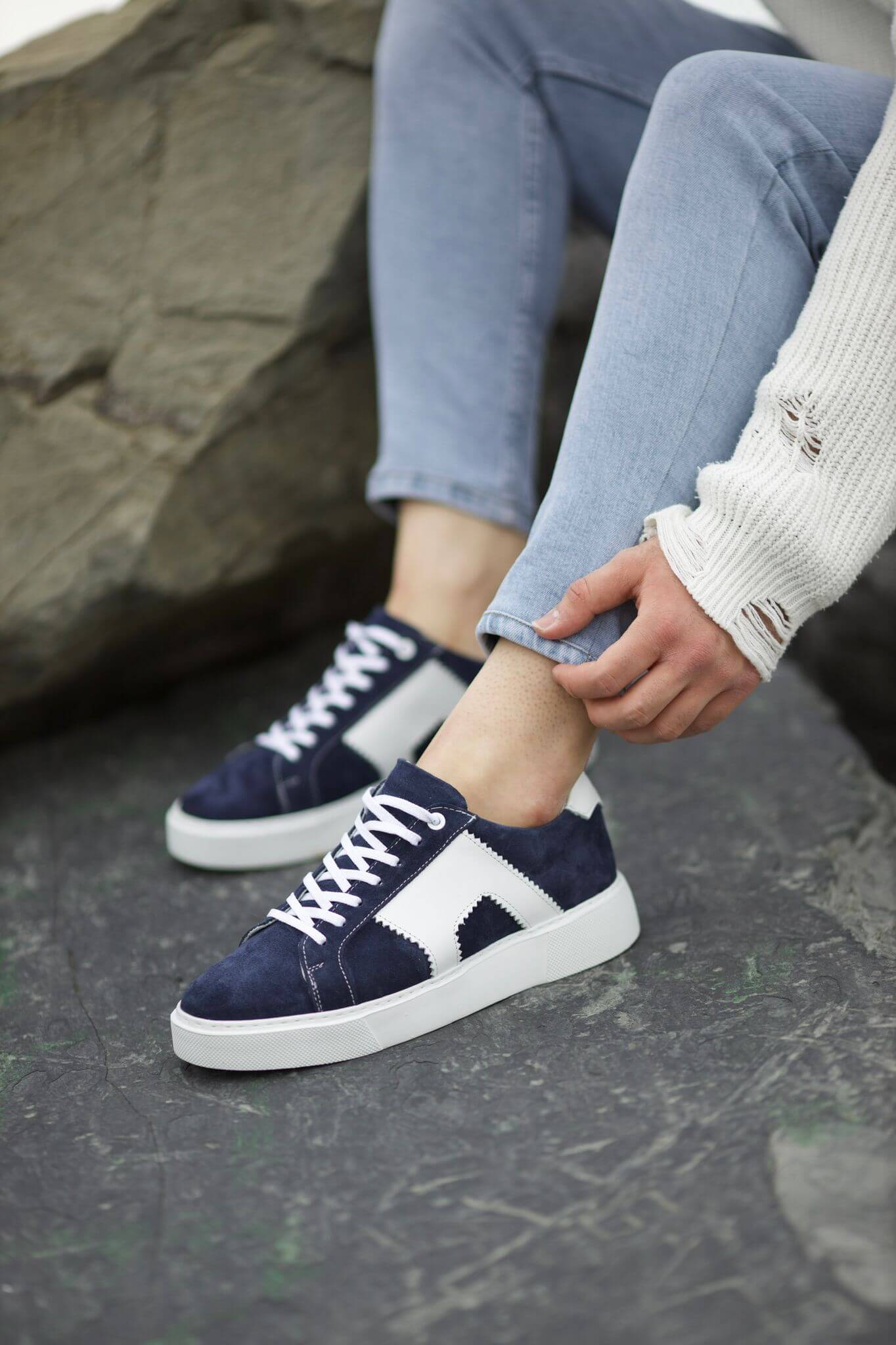 A Navy-Blue Lace Up Sneaker on display.