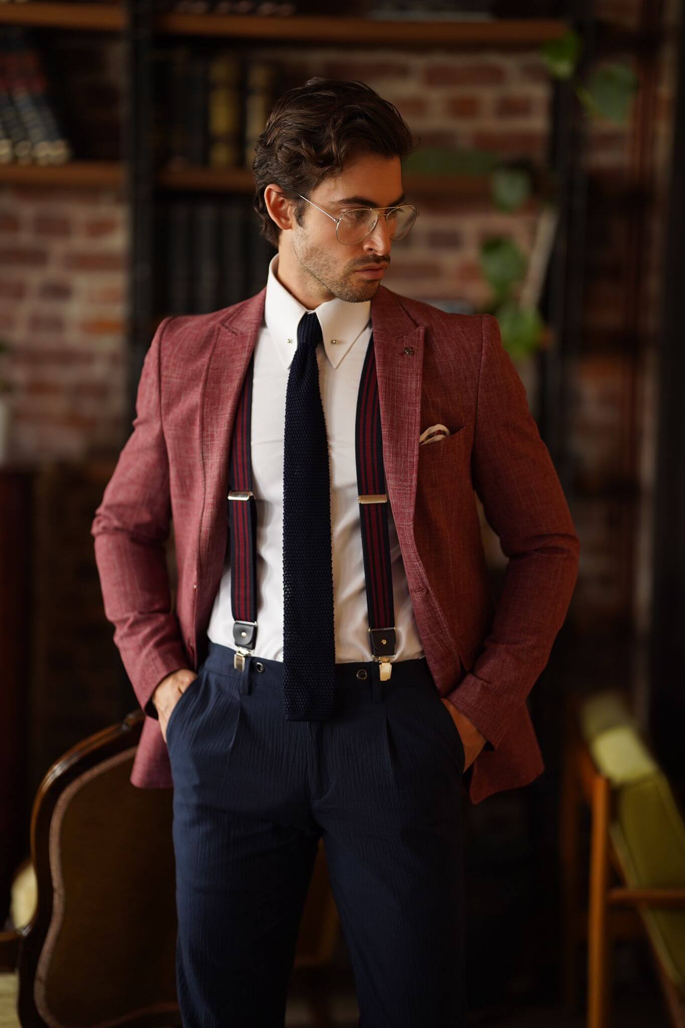 A Slim-Fit Self patterned Cotton Claret Red Blazer on display.