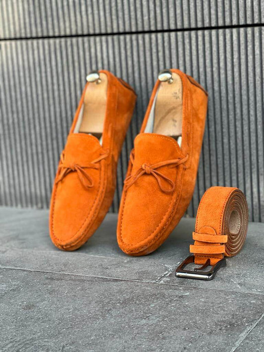 Bright orange leather casual loafers featuring a slip-on design and rubber soles, styled for vibrant spring and summer looks.