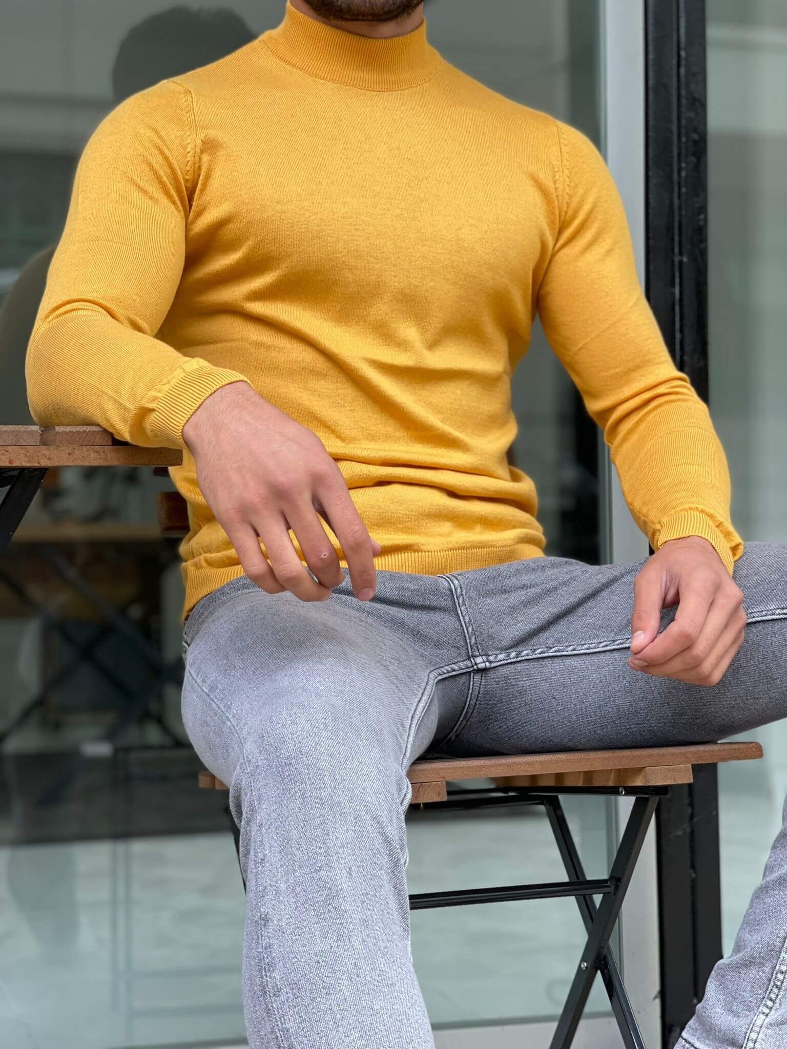 "An Osaka Mustard Half Turtleneck sweater, featuring a warm mustard color, a cozy half turtleneck collar, and a stylish design perfect for cooler weather."