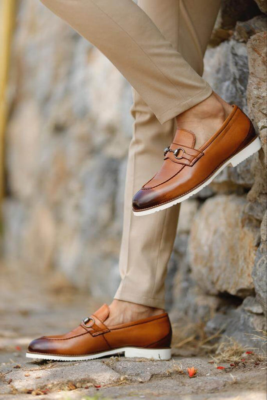 Elegant brown patent leather loafers with a sleek slip-on design and EVA sole, styled against a neutral background, ideal for warm-weather sophistication.