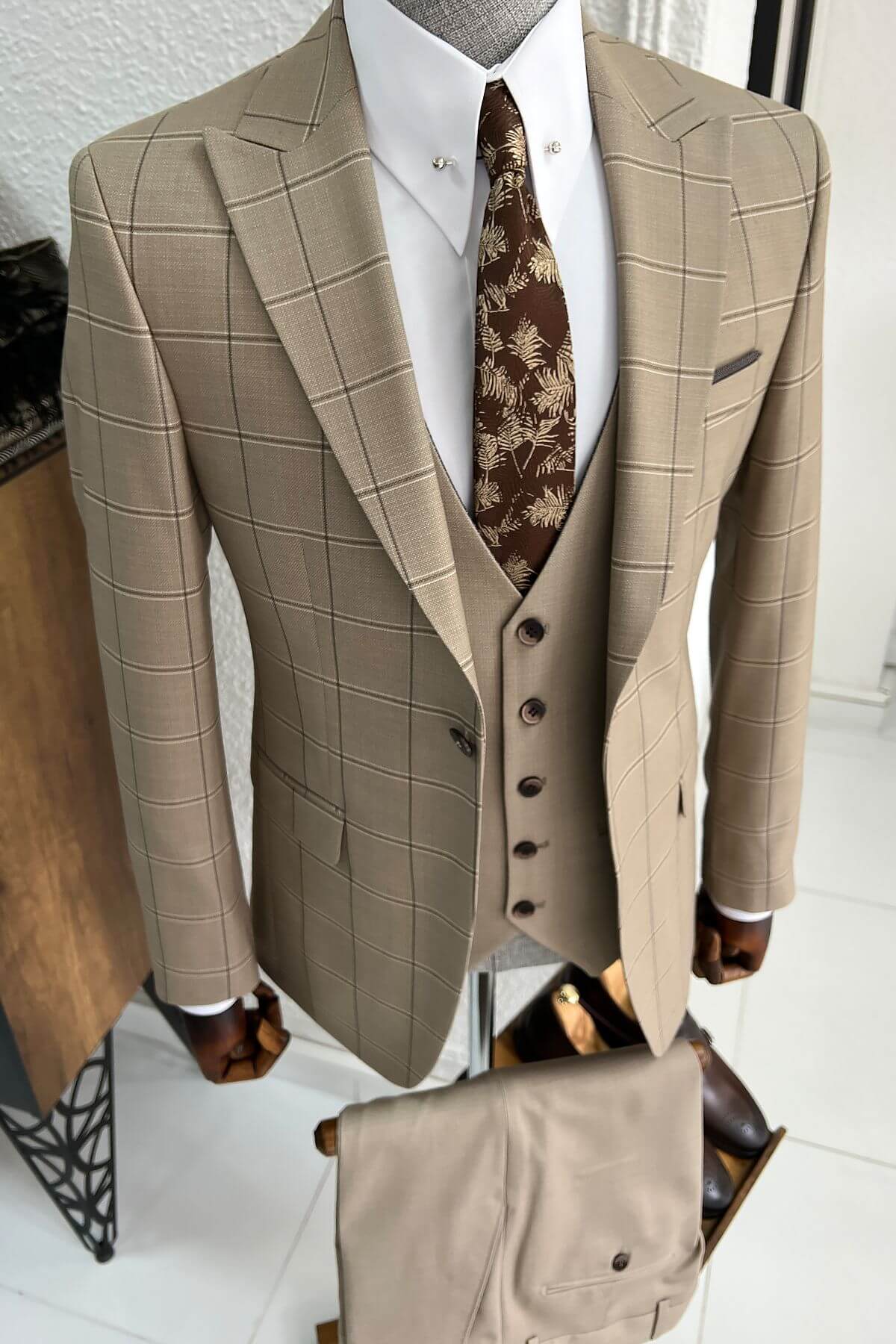 A Patterned Beige Wool Suit on display